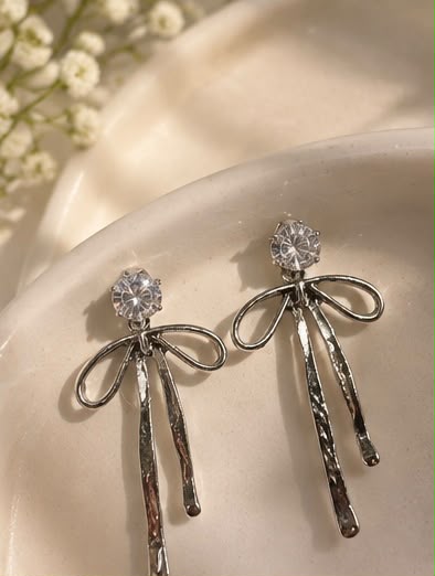 Silver tassel bow earrings